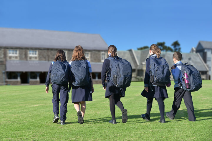 School Students Walking Together To School